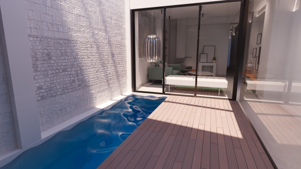 Cette image montre une petite piscine minimaliste rectangle avec des solutions pour vis-à-vis et une terrasse en bois.