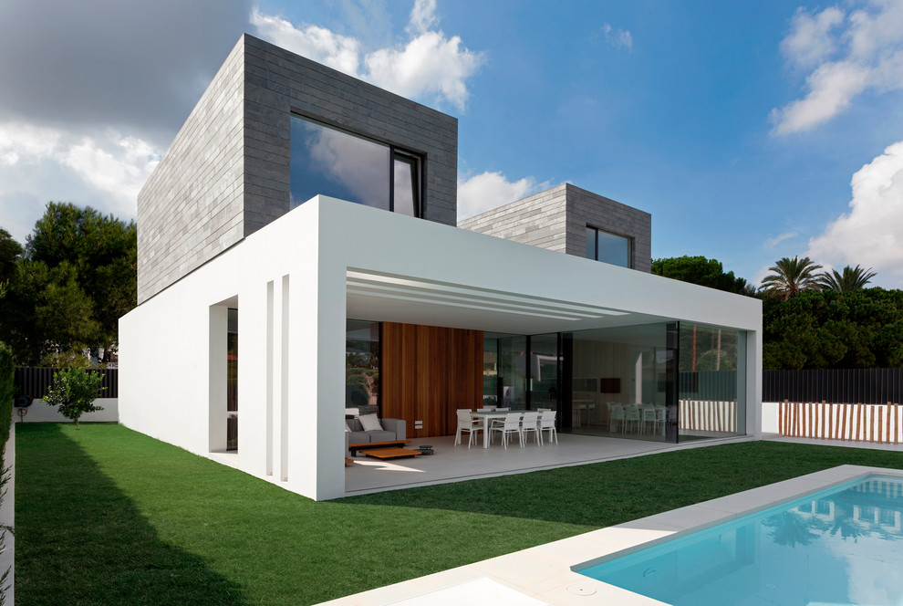Inspiration for a contemporary rectangular swimming pool in Other with a pool house.