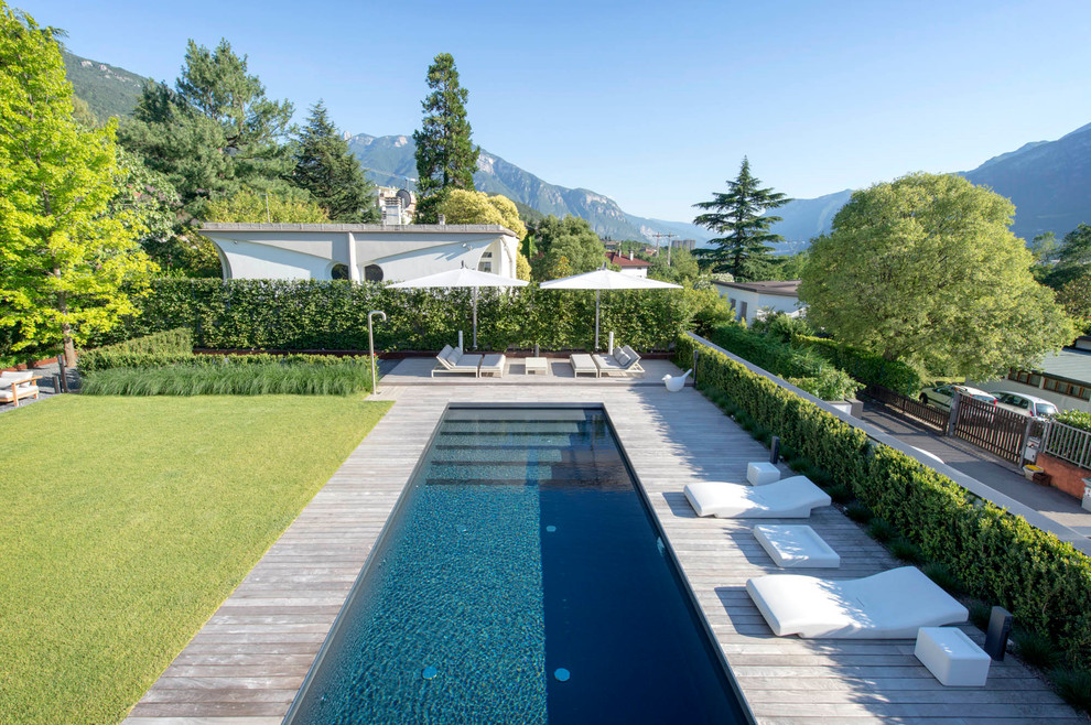 Inspiration for a contemporary swimming pool in Bologna with decking.