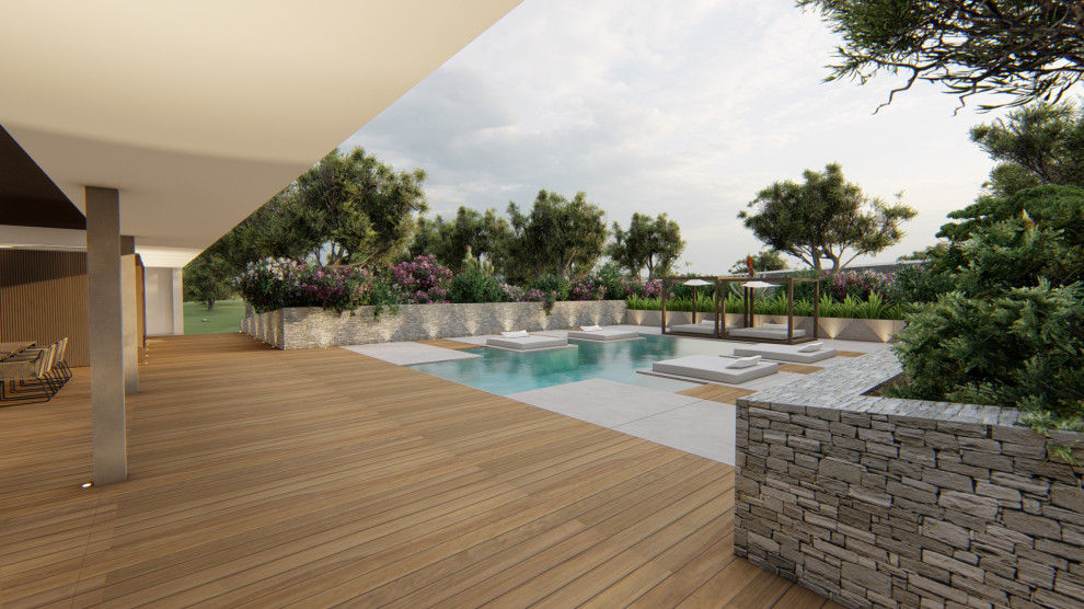Modelo de piscina alargada actual grande a medida en patio trasero con paisajismo de piscina y losas de hormigón