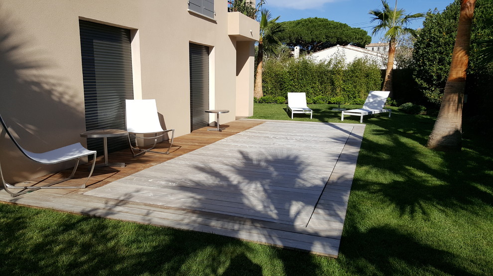 Photo of a medium sized mediterranean rectangular lengths swimming pool in Toulouse with decking.