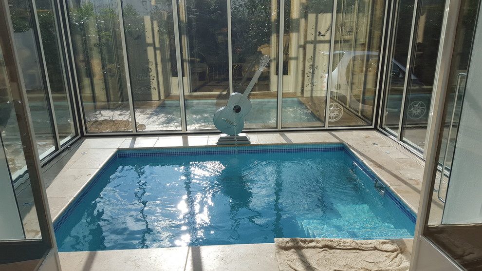 Design ideas for a small contemporary indoor rectangular swimming pool in Paris.