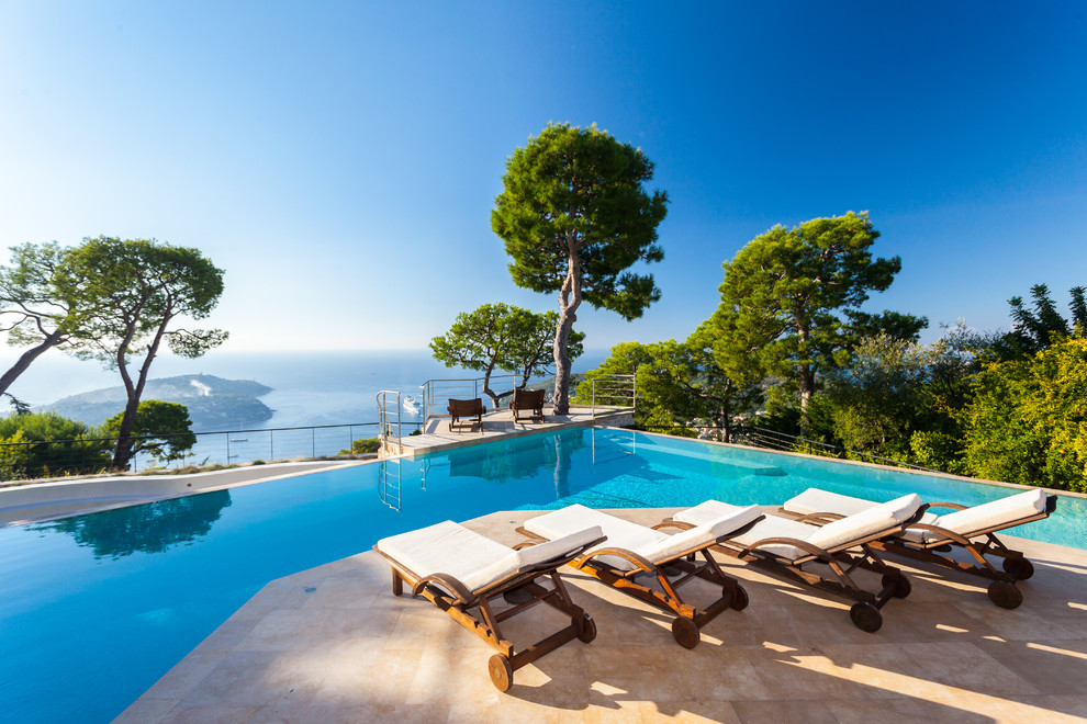 Example of a huge tuscan custom-shaped infinity pool design in Nice