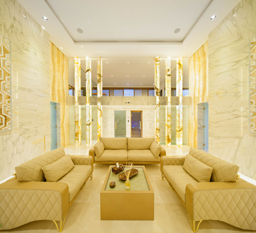 Design ideas for a large contemporary walk-out basement in Moscow with white walls, marble flooring and no fireplace.