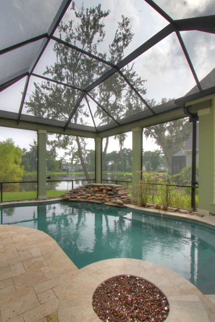 Example of a backyard custom-shaped pool design in Atlanta