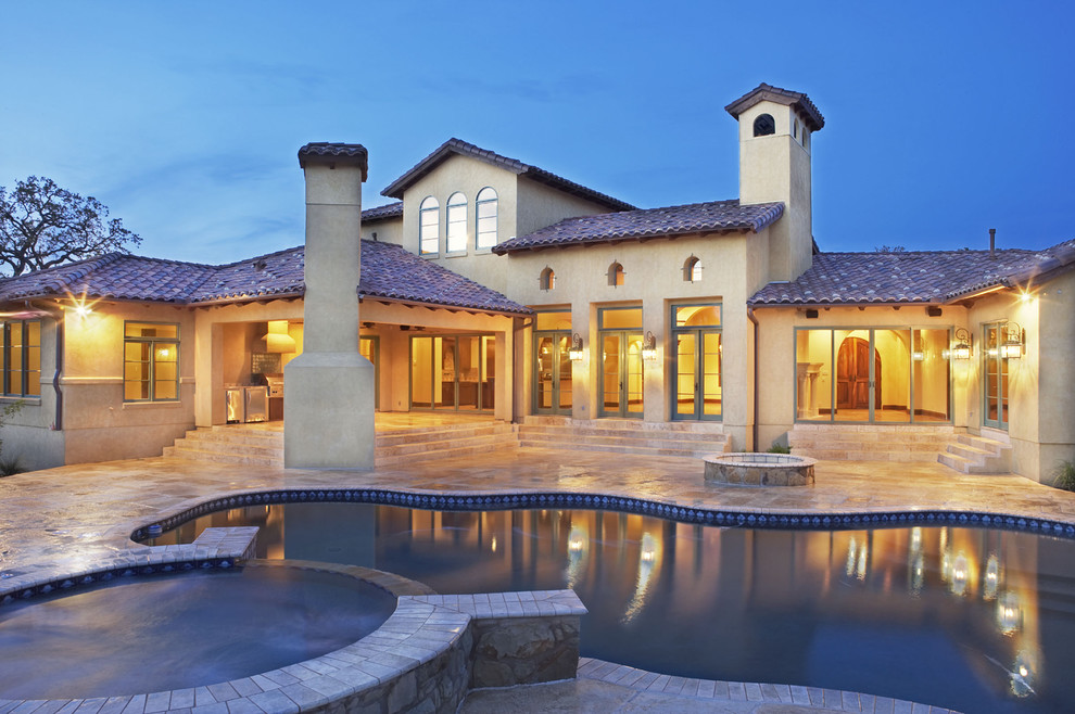 This is an example of a mediterranean custom shaped swimming pool in Austin.