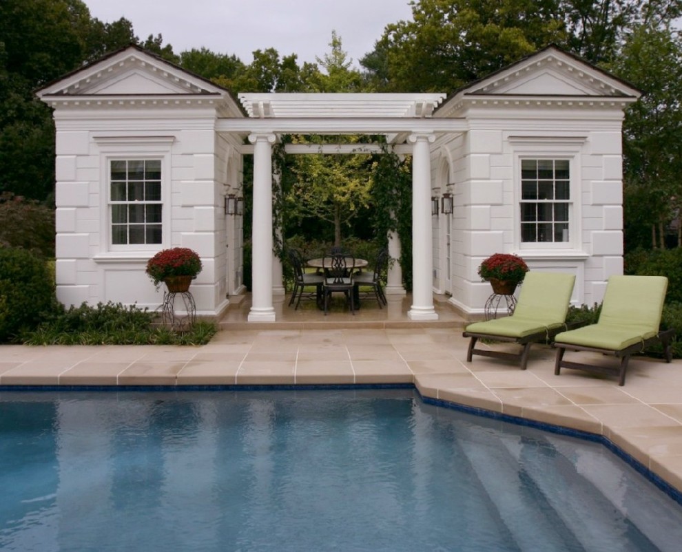 This is an example of a classic custom shaped swimming pool in Nashville with a pool house.