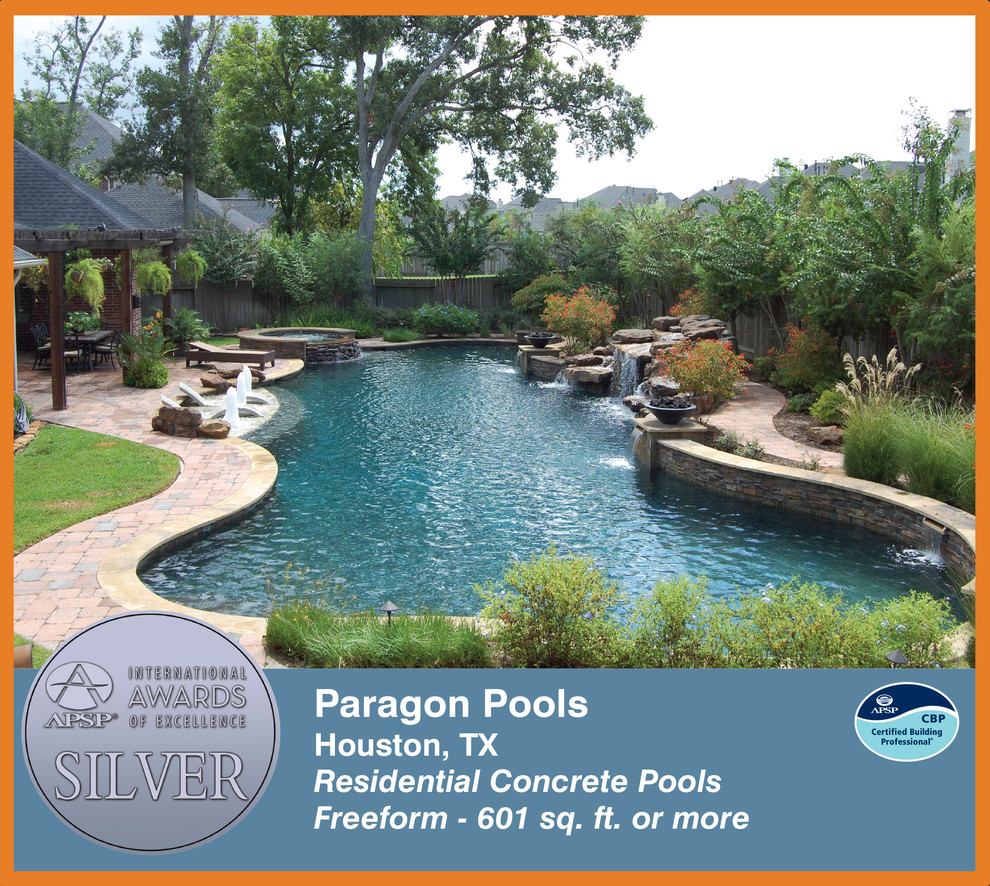 Elegant backyard custom-shaped pool photo in Houston