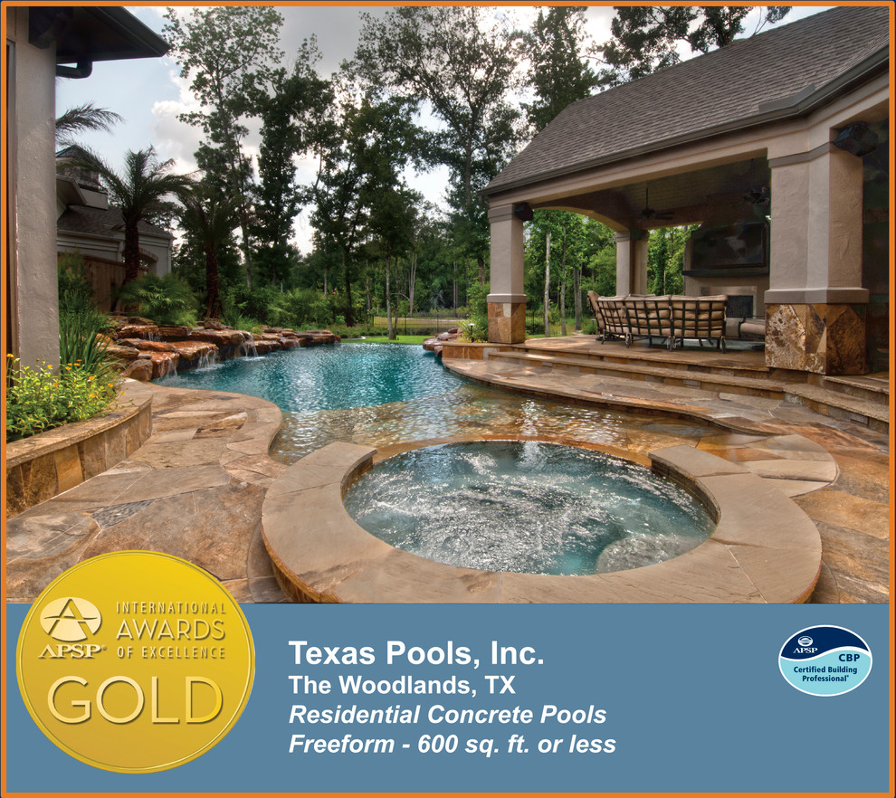 Example of a cottage backyard custom-shaped natural pool fountain design in Houston