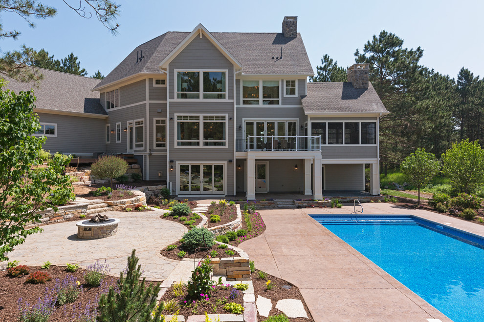 Inspiration for a huge timeless backyard stone and rectangular lap pool remodel in Minneapolis