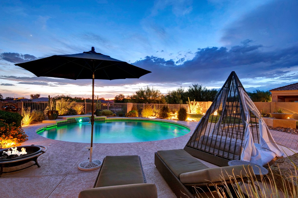 Pool - contemporary backyard round lap pool idea in Phoenix