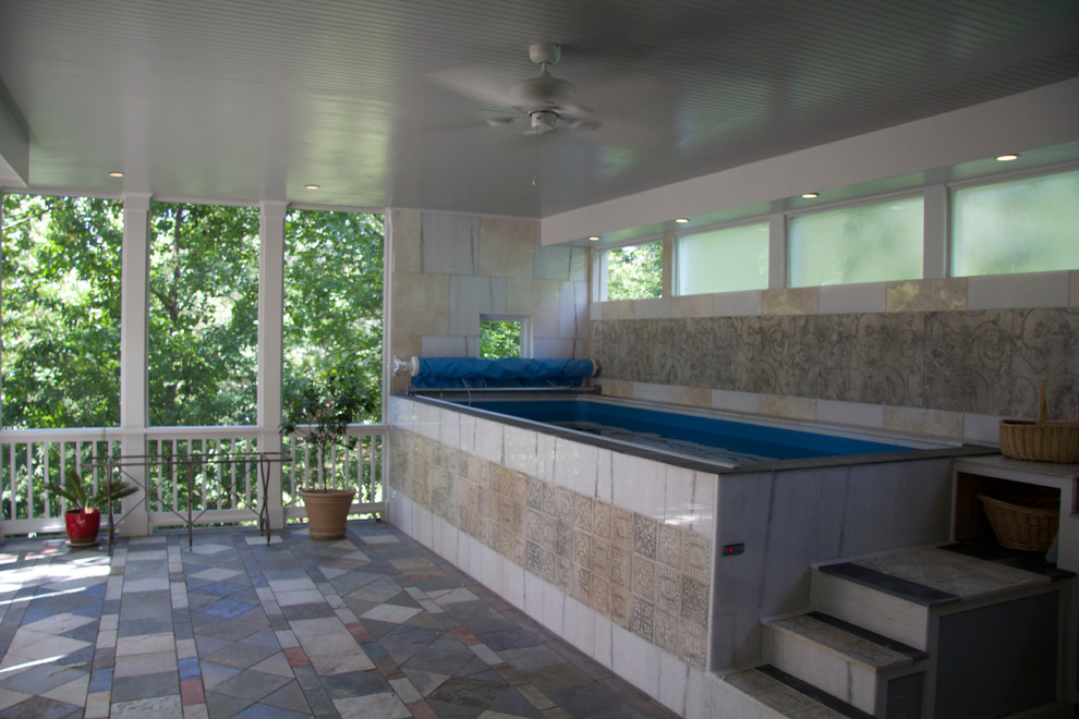 Inspiration for a small mediterranean back rectangular above ground hot tub in Atlanta with tiled flooring.