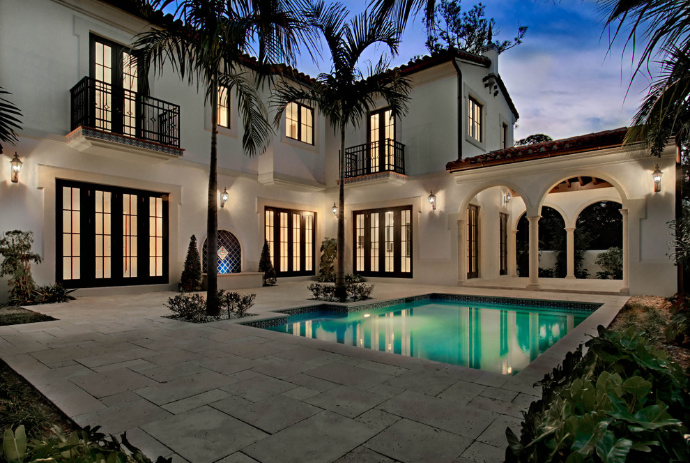 Inspiration for a mediterranean rectangular pool remodel in Miami
