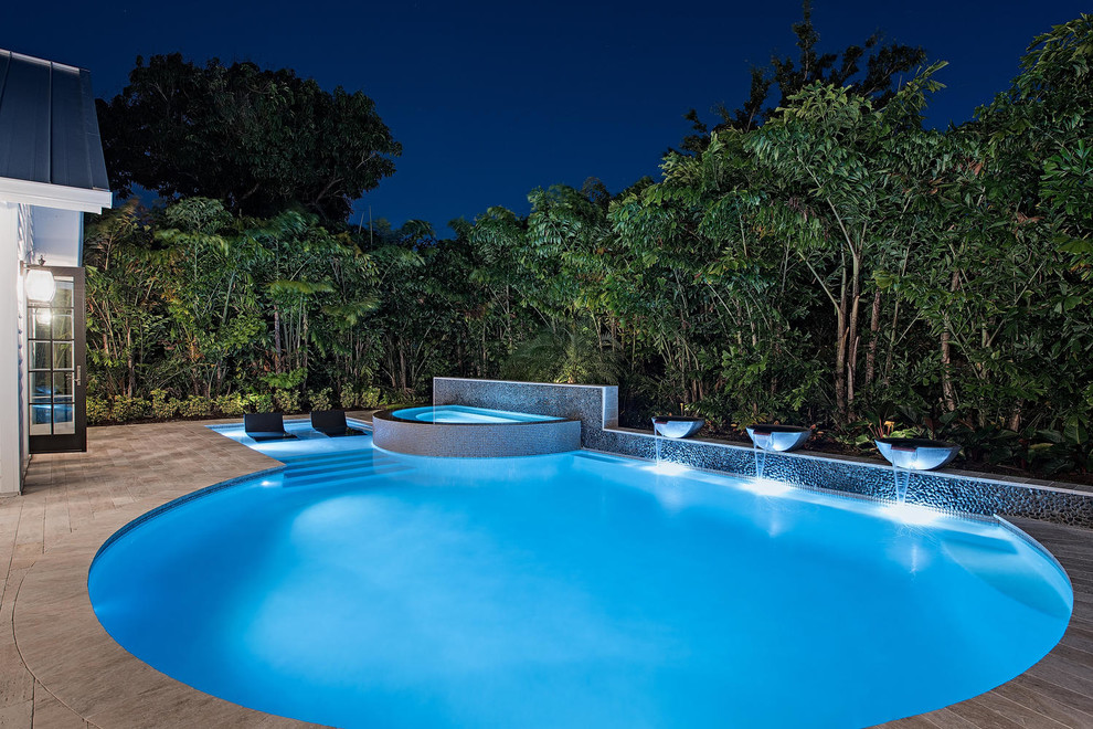 Design ideas for a beach style swimming pool in Miami.