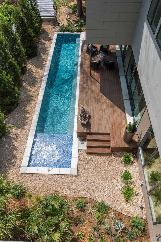 Mid-sized trendy backyard rectangular lap pool photo in Atlanta with decking