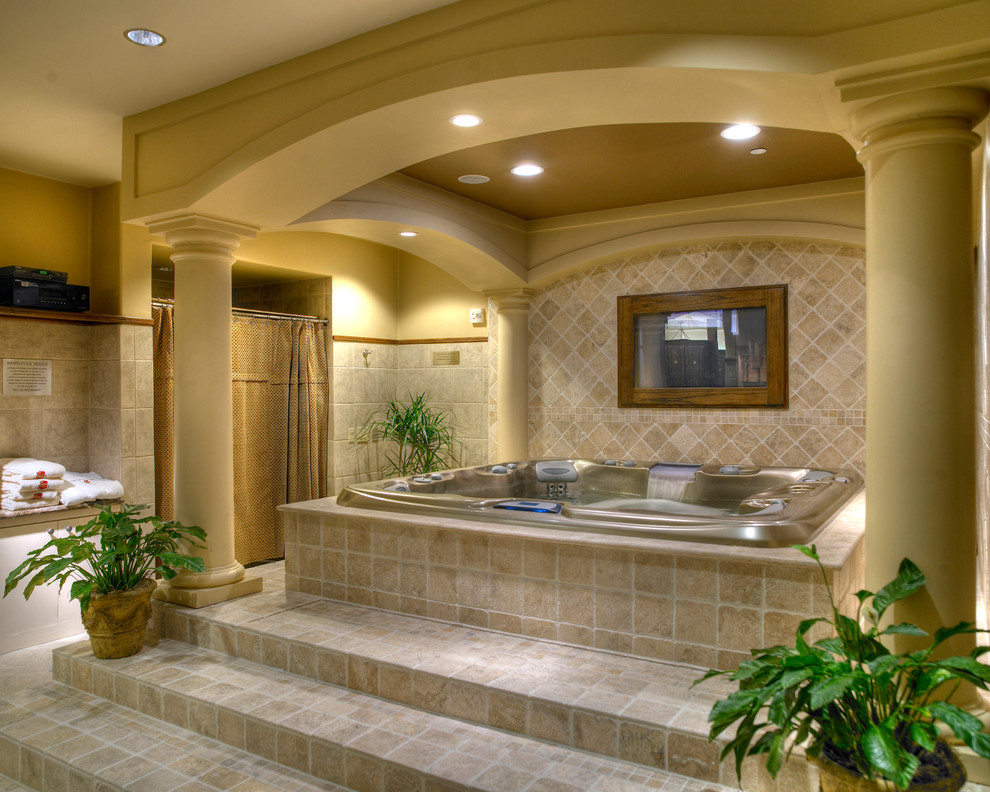 This is an example of a small mediterranean indoor custom shaped hot tub in Houston with tiled flooring.