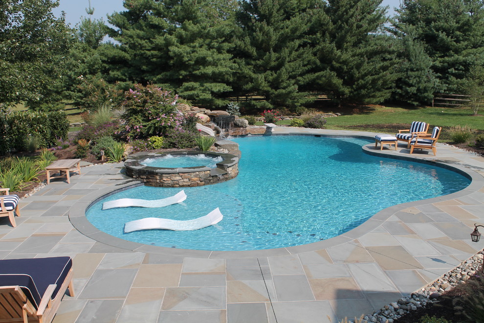 Design ideas for a traditional custom shaped swimming pool in Philadelphia.