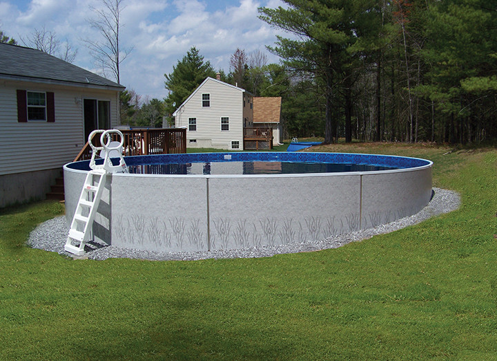 Idee per una grande piscina fuori terra chic personalizzata dietro casa con ghiaia