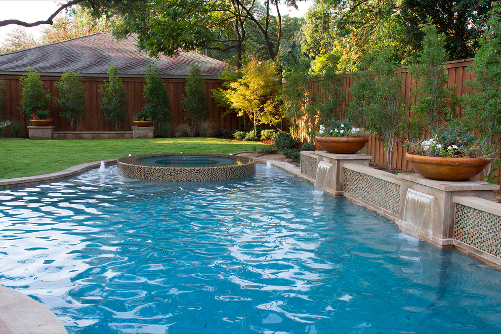 Hot tub - large contemporary backyard concrete paver and custom-shaped lap hot tub idea in Dallas