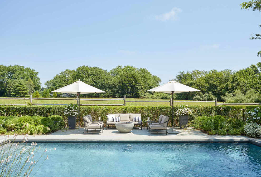 Example of a mid-sized beach style pool design in New York