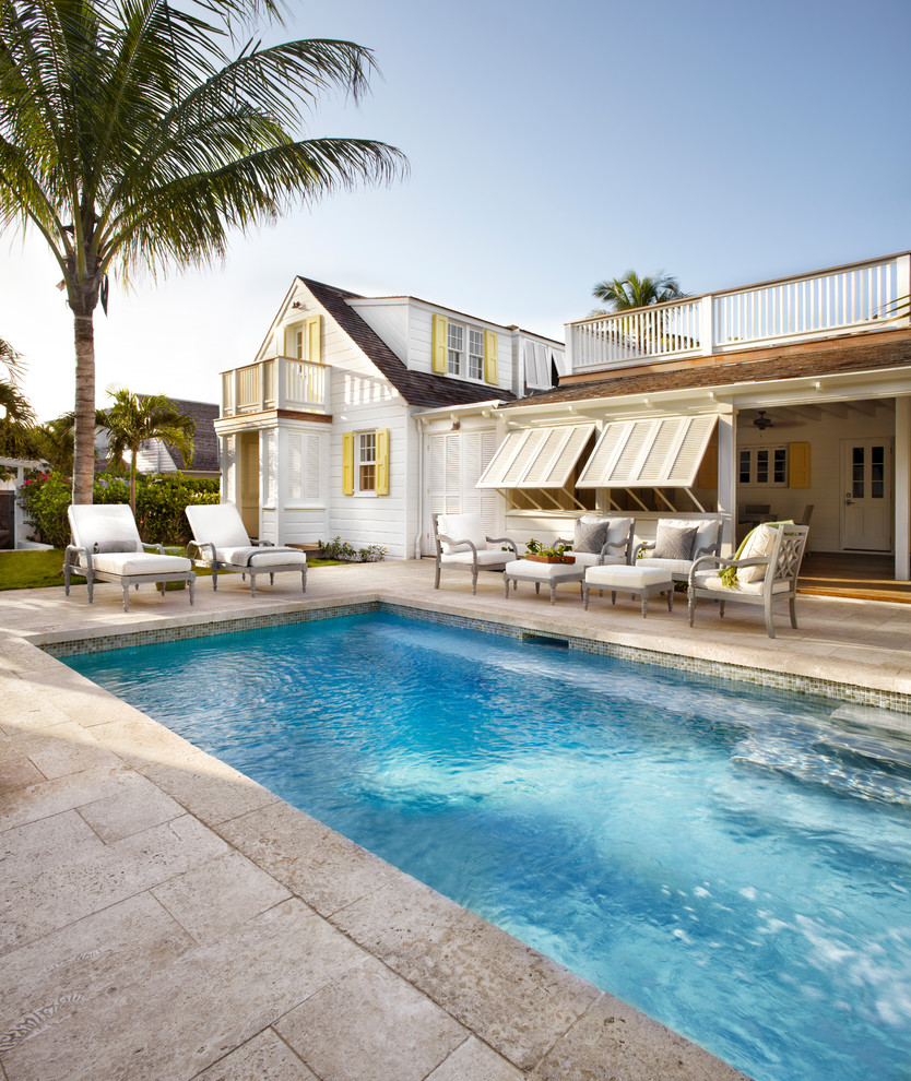 Example of a beach style backyard rectangular pool design in Toronto