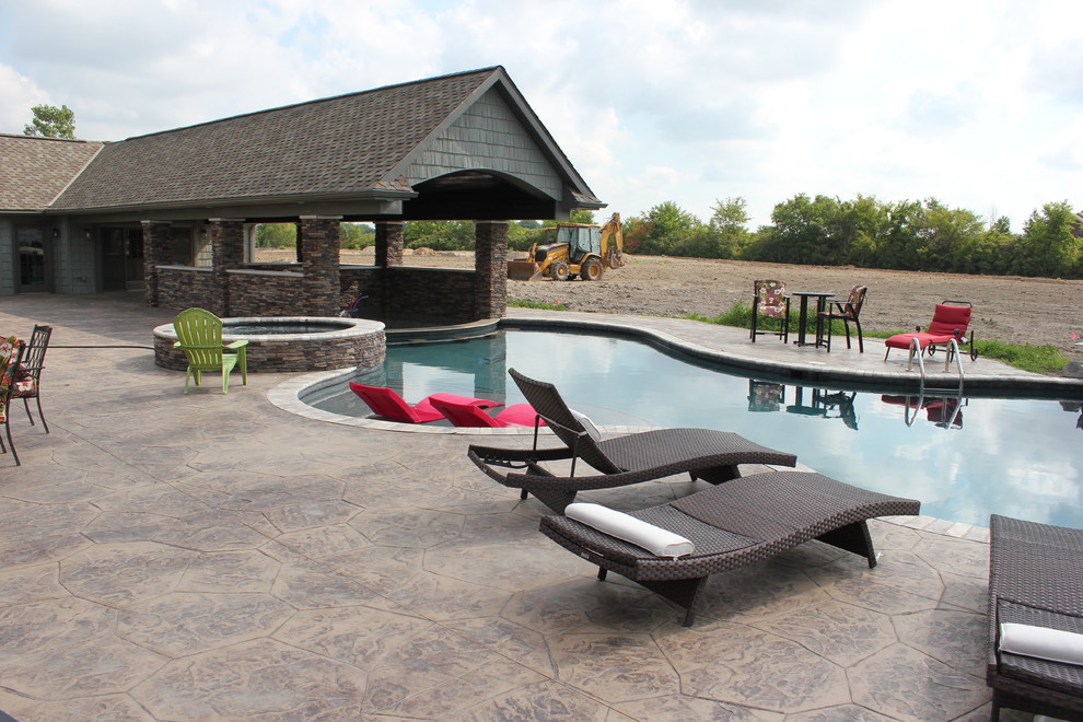 Design ideas for a large contemporary natural swimming pool in Other.