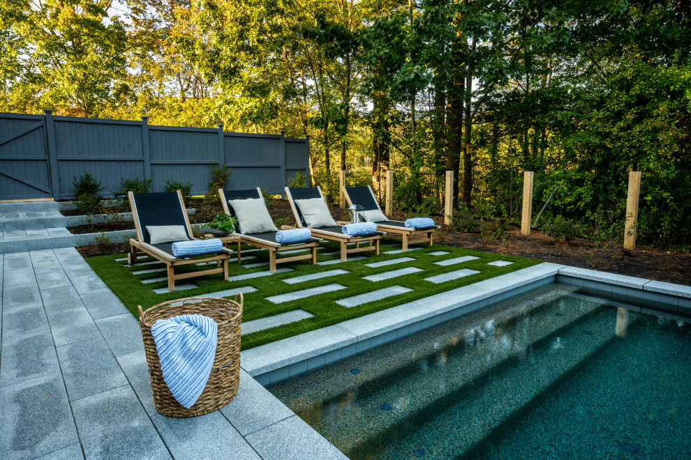 Small contemporary back private and rectangular lengths swimming pool in Boston with concrete slabs.