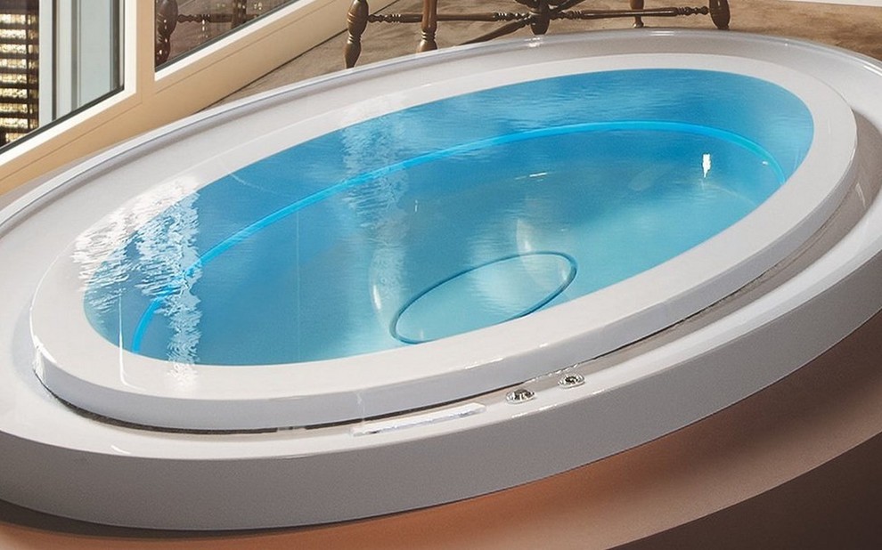 Example of a huge minimalist indoor custom-shaped infinity hot tub design in Miami