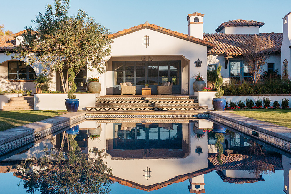 Huge elegant backyard rectangular and stone lap pool photo in Phoenix