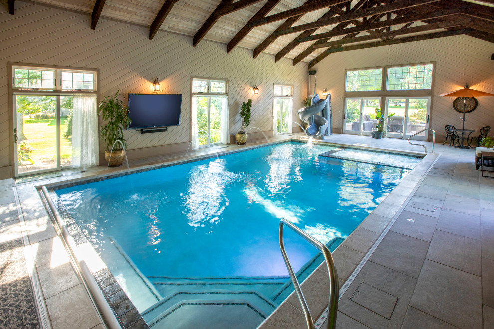 Diseño de casa de la piscina y piscina alargada clásica de tamaño medio interior y rectangular con adoquines de piedra natural