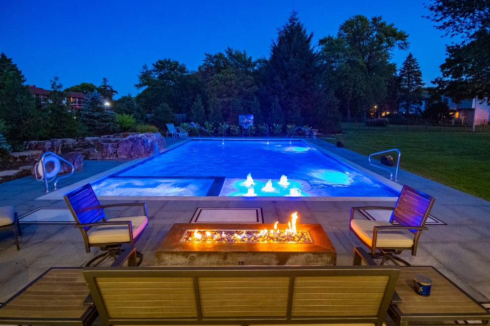 Inspiration for a mid-sized timeless backyard stone and rectangular lap pool landscaping remodel in Chicago