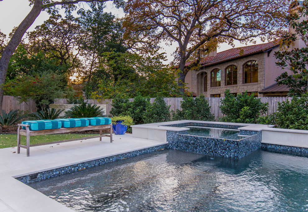 Mid-sized transitional backyard stone and rectangular lap hot tub photo in Austin