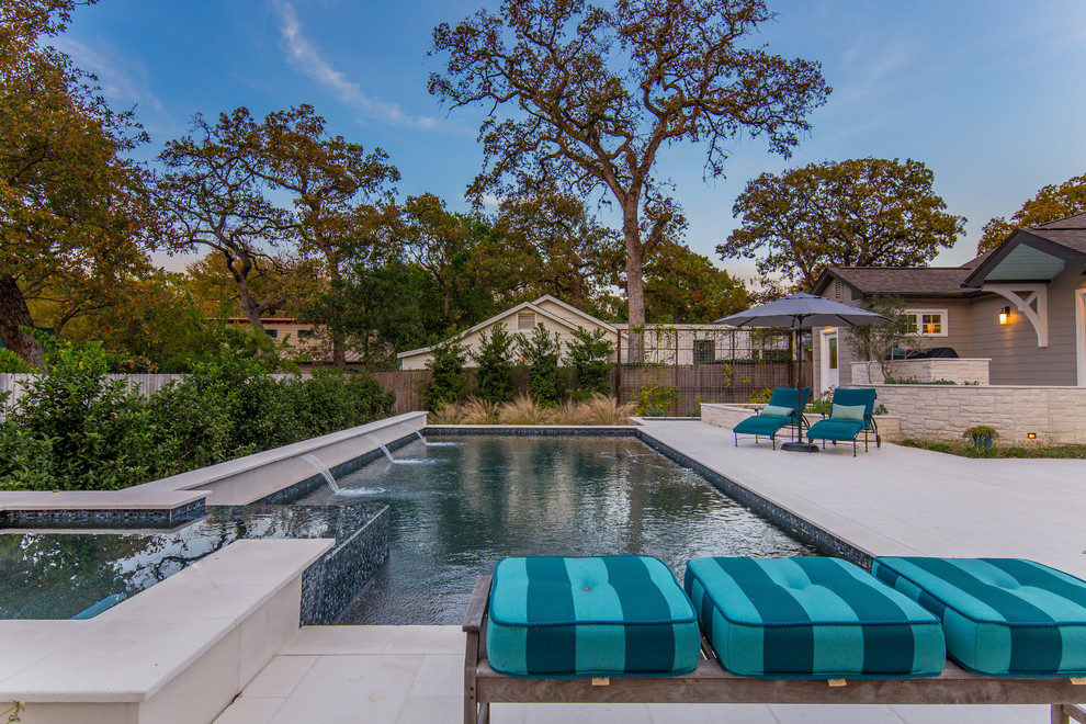 Hot tub - mid-sized transitional backyard stone and rectangular lap hot tub idea in Austin