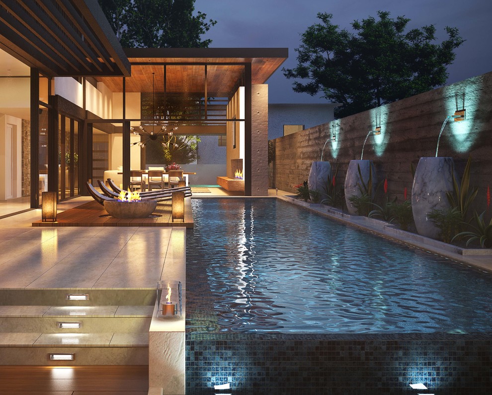 Идея дизайна: большой прямоугольный бассейн-инфинити на заднем дворе в стиле модернизм с покрытием из плитки
