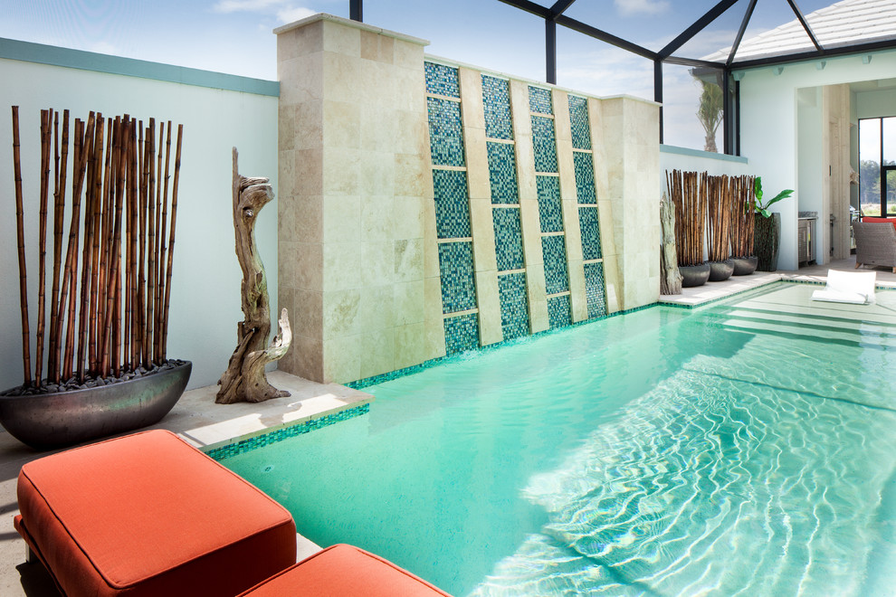 Pool fountain - mid-sized zen backyard stone and rectangular lap pool fountain idea in Miami