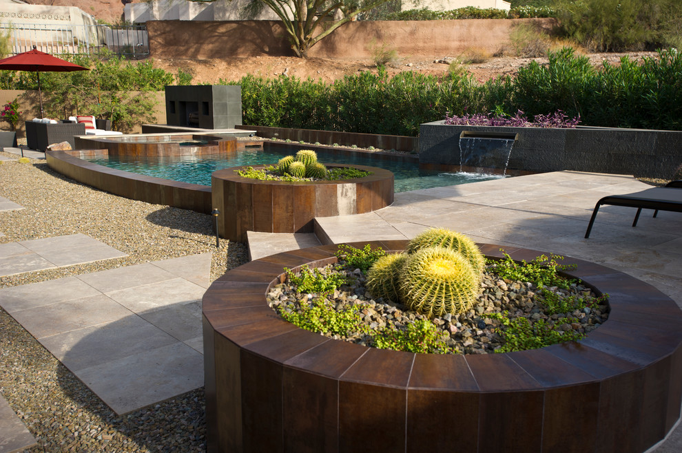 This is an example of a custom shaped swimming pool in Phoenix with gravel.