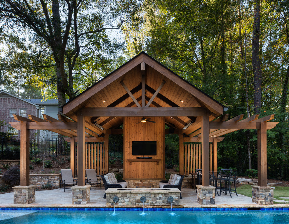 Inspiration pour un Abris de piscine et pool houses arrière traditionnel de taille moyenne et rectangle avec des pavés en pierre naturelle.