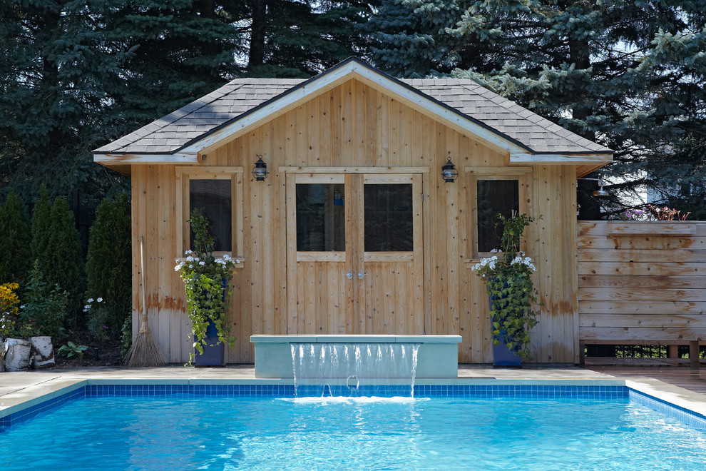 Mid-sized minimalist backyard concrete paver and rectangular lap hot tub photo in Toronto