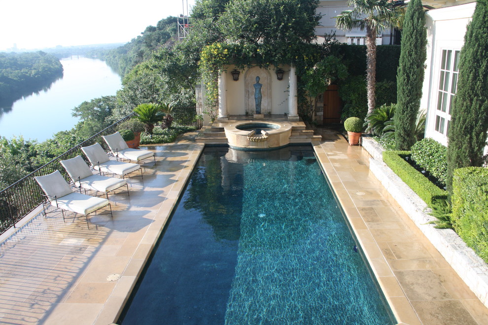 Pool - mid-sized mediterranean backyard stone and rectangular pool idea in Austin