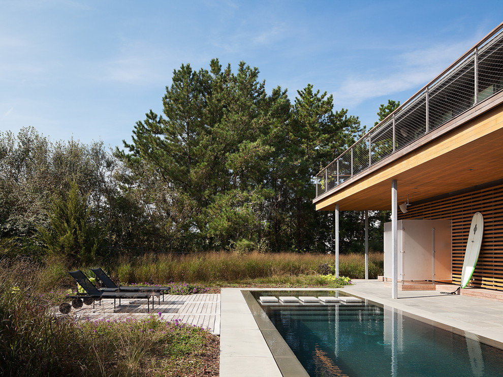 Trendy concrete and rectangular lap pool photo in Philadelphia