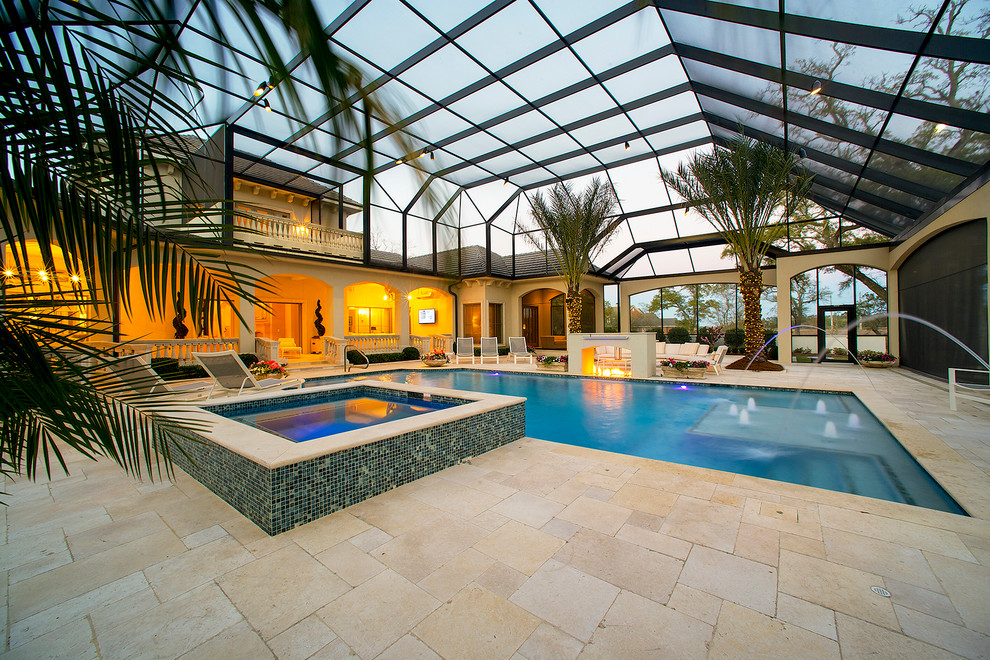 Esempio di una grande piscina coperta chic rettangolare con una vasca idromassaggio e piastrelle