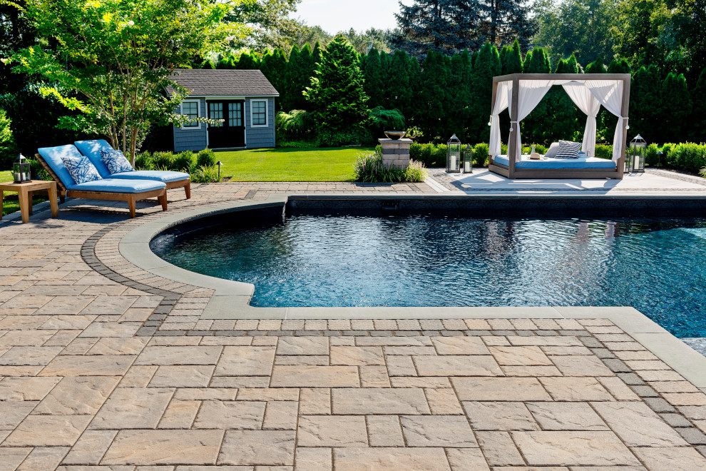 Design ideas for a classic back swimming pool in New York with concrete paving.