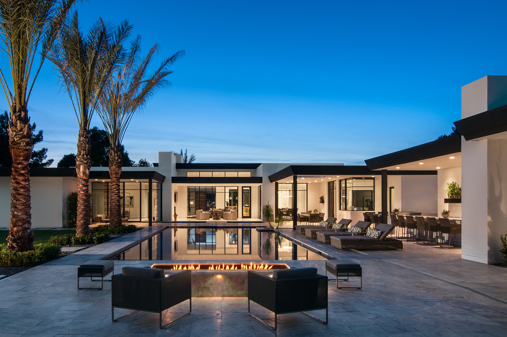 Hot tub - contemporary backyard rectangular and tile infinity hot tub idea in Phoenix