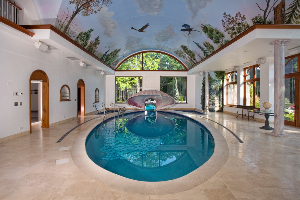 Foto de piscina mediterránea extra grande a medida y interior con adoquines de piedra natural