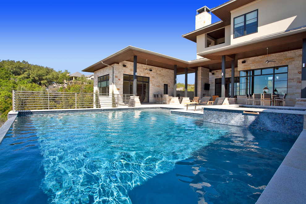 Design ideas for a contemporary infinity swimming pool in Austin.