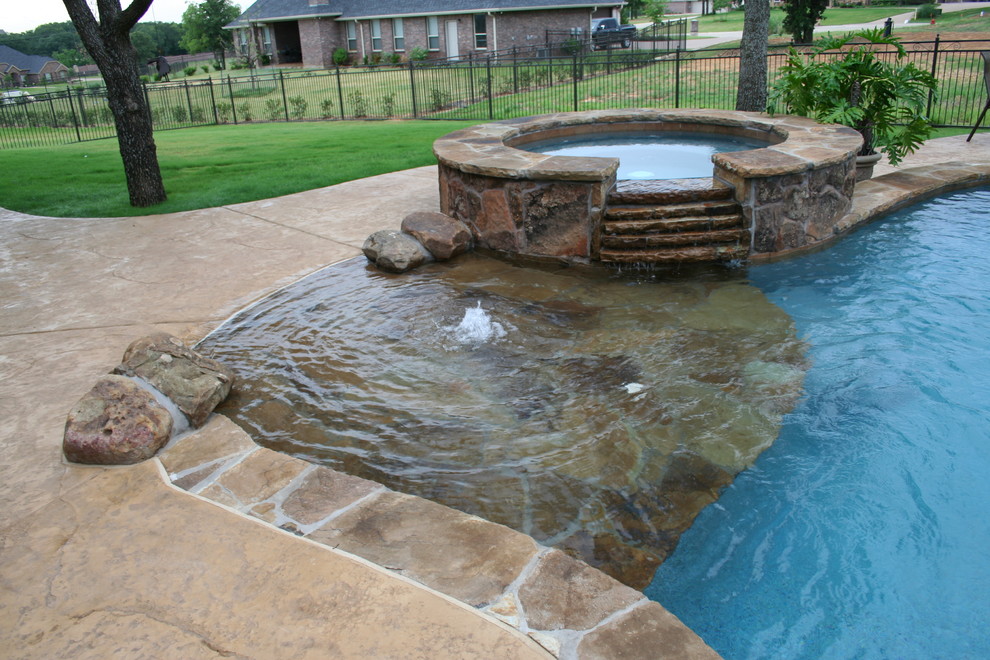 Example of a beach style pool design in Dallas
