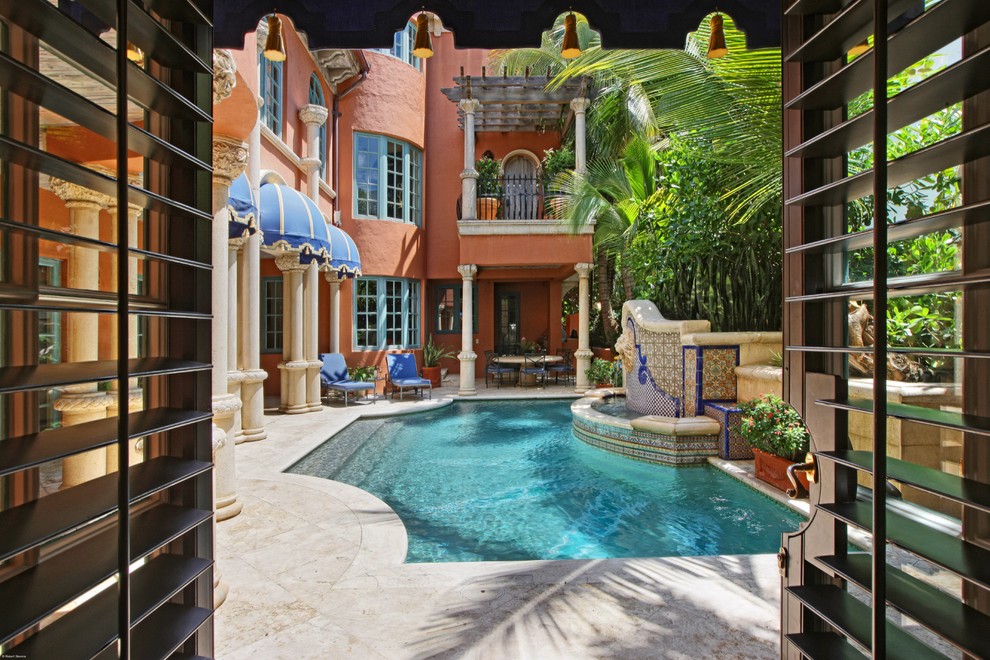 Example of a tuscan courtyard pool design in Miami