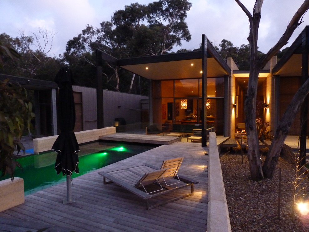 Design ideas for a beach style swimming pool in Melbourne.