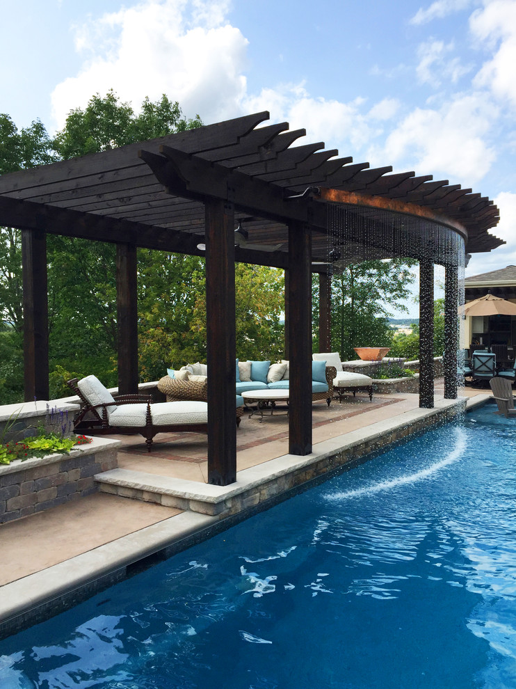 Pool fountain - transitional backyard concrete and rectangular lap pool fountain idea in Milwaukee