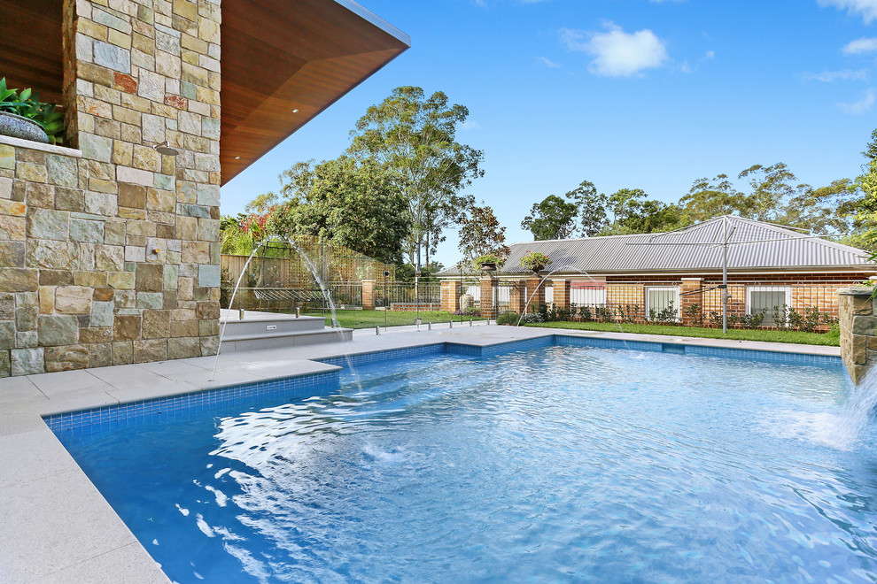 Inspiration for a mid-sized timeless pool remodel in Sydney